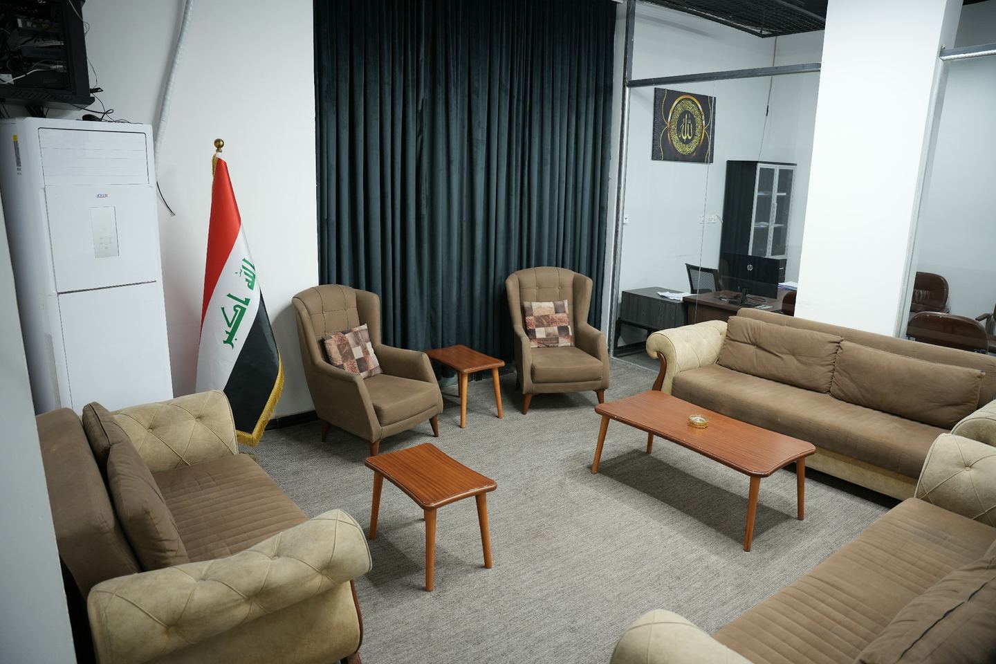 Reception lounge with sofas, armchairs and wooden tables